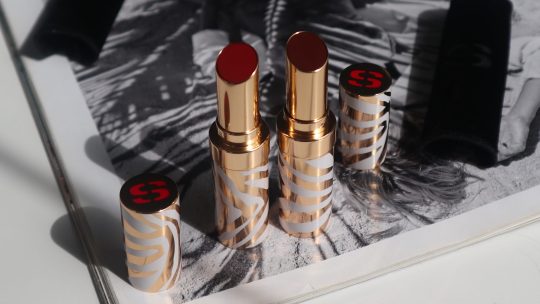 Sisley Phyto-Rouge Shine lipstick tubes in new shades 43 Sheer Scarlet and 14 Sheer Acajou